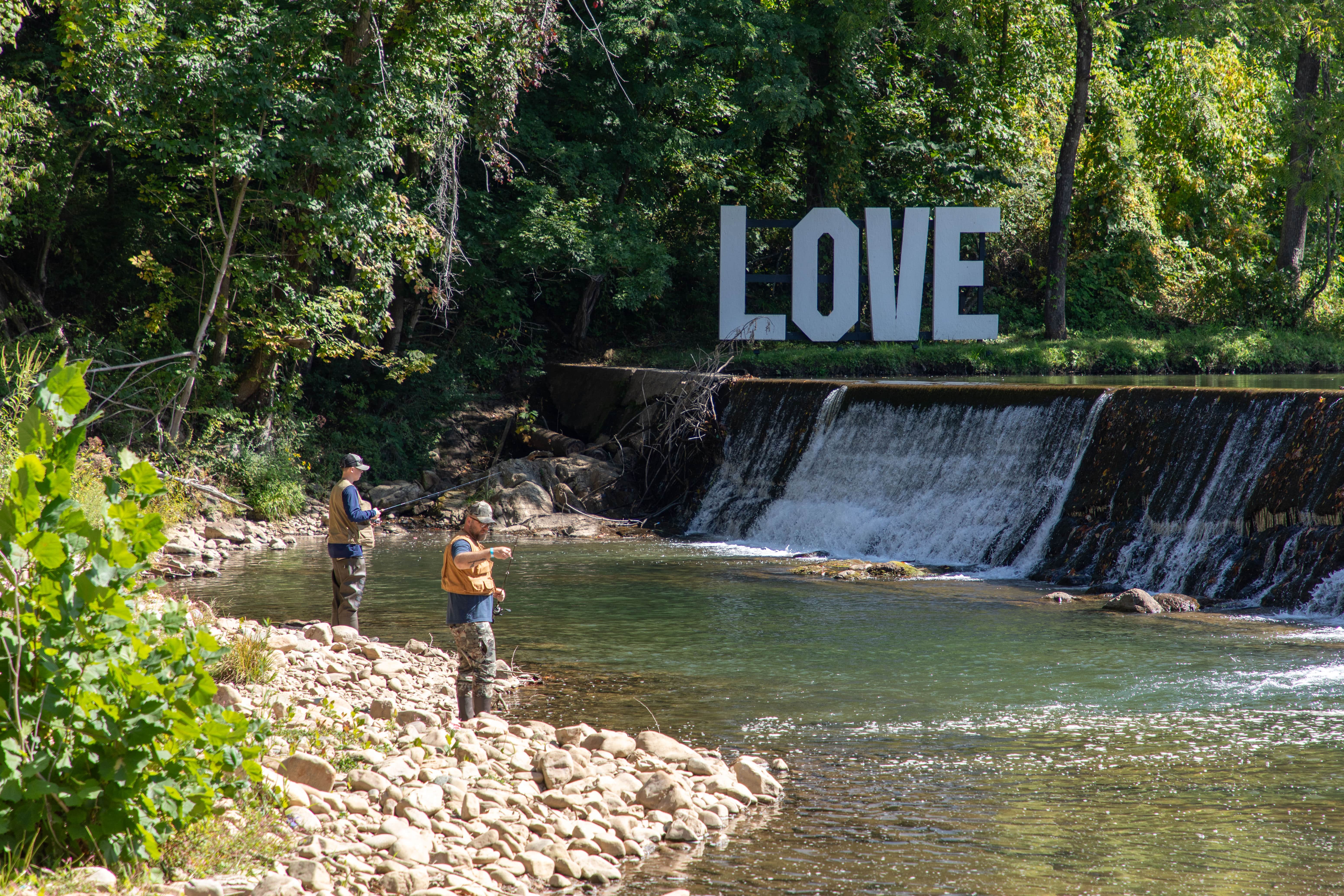 Trout fishing below the mill dam LOVE sign